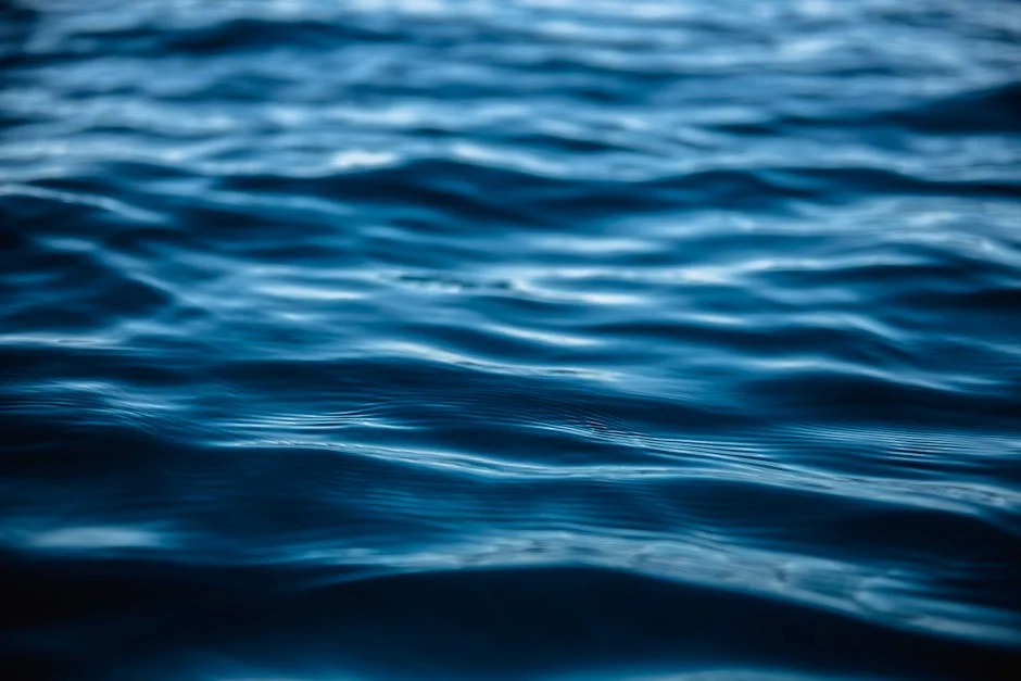 Close-up view of tranquil ocean waves with blue hues illustrating serenity and nature's beauty.